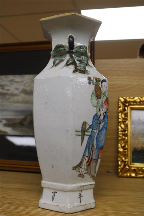 A Chinese porcelain vase decorated in enamels with figures in a garden 33cm